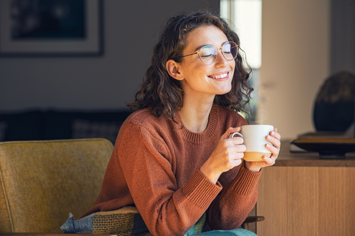 Happy Woman Drinking Hot Tea